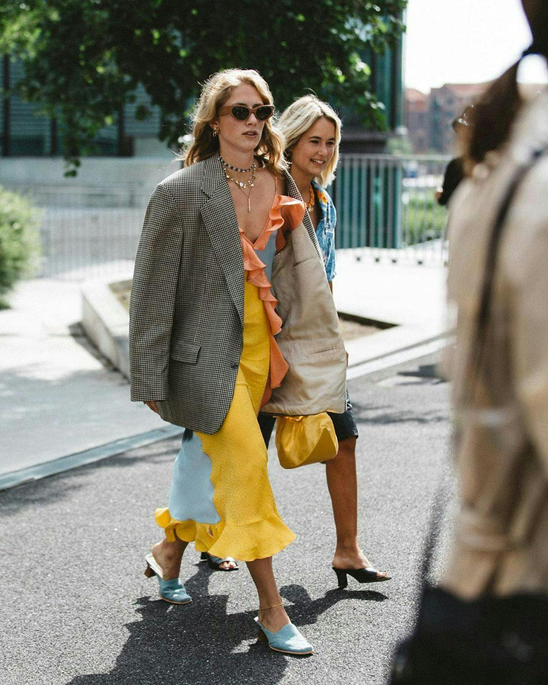 clothing apparel person sunglasses accessories road pedestrian shorts tarmac footwear