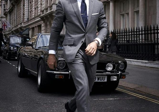 suit clothing overcoat coat shoe person tie sunglasses car man