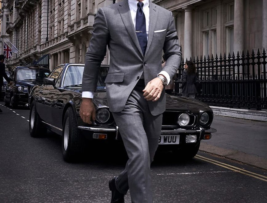 suit clothing overcoat coat shoe person tie sunglasses car man