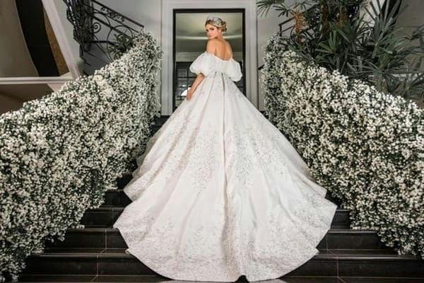 clothing apparel wedding gown wedding fashion gown robe person tree plant