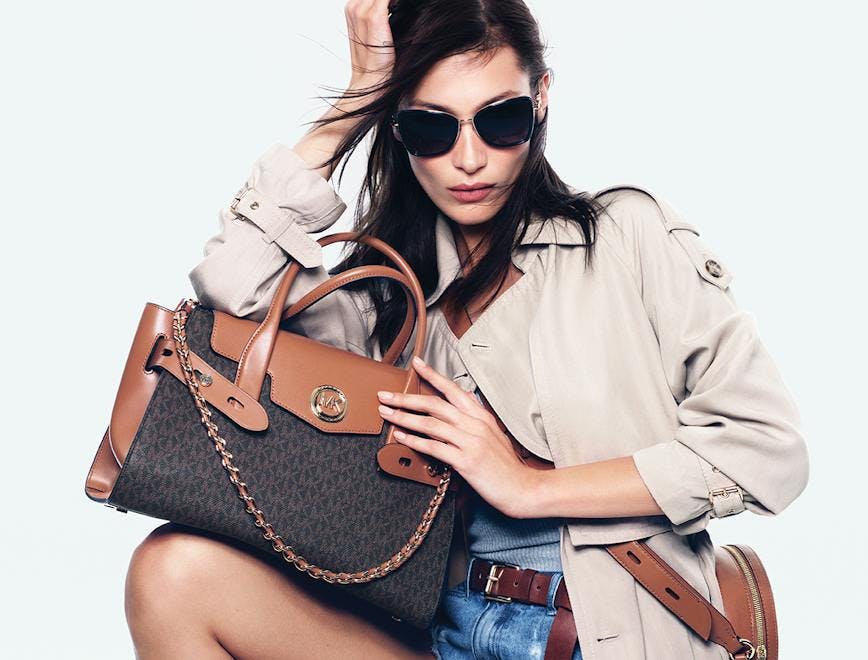sunglasses accessories accessory handbag bag person human clothing apparel purse