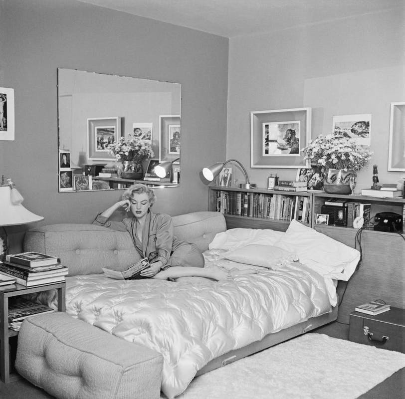 book furniture bed bedroom room indoors person human interior design