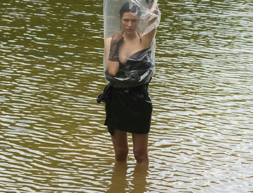 clothing apparel water outdoors person human shorts plastic bag plastic bag