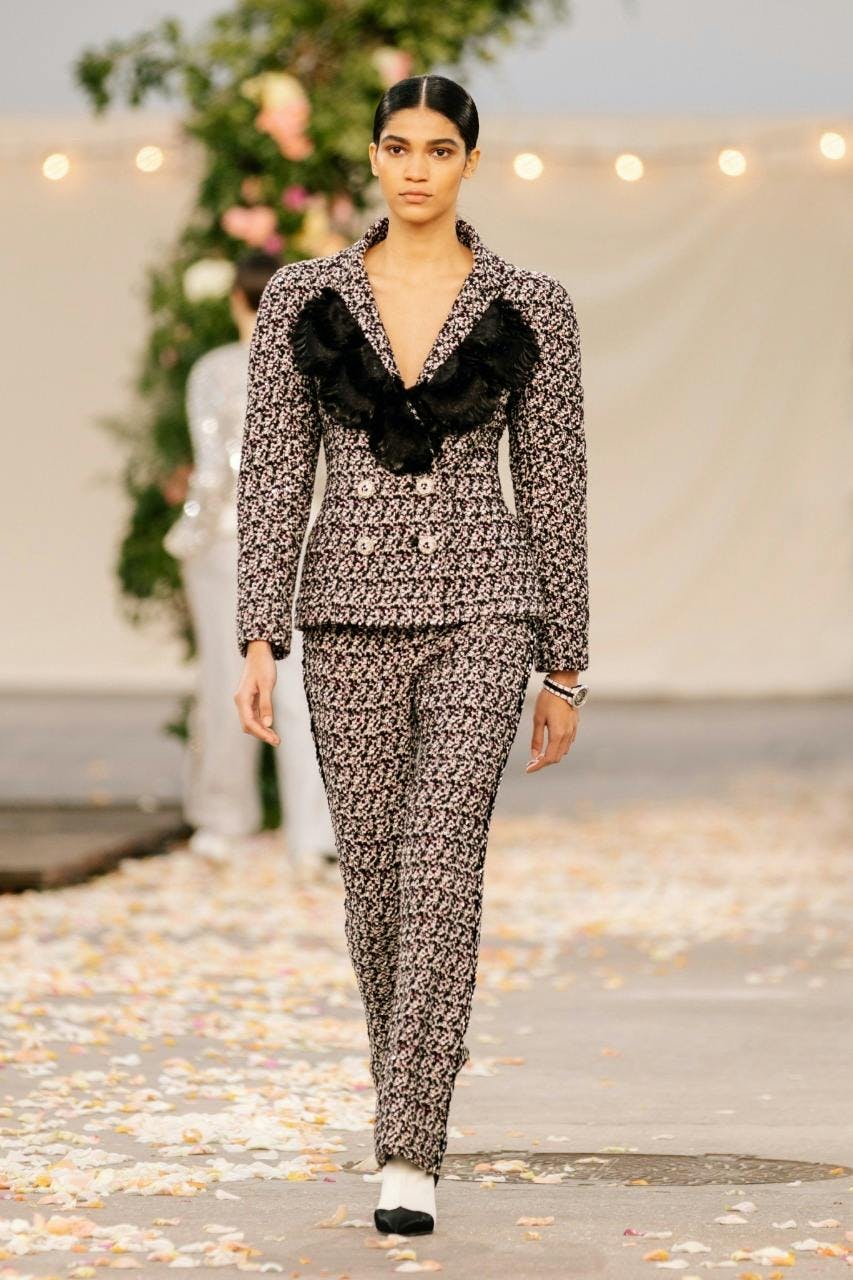 clothing apparel female person dress suit coat overcoat woman runway