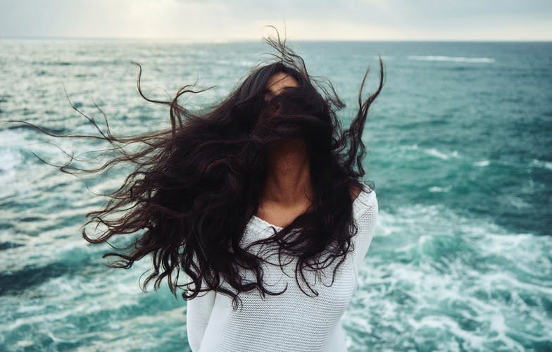 clothing apparel person sea water outdoors nature sleeve hair female