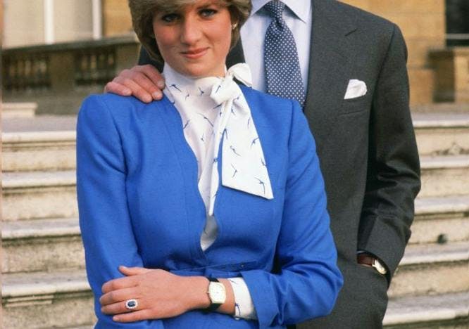 accessories watches touching together smiling royalty royals royal couples rings photocalls official role mannerisms loving jewels jewellery happy hands in pockets handbags eyes to camera england engagements celebrations british royal family blouses affectionate tie clothing blazer coat jacket sleeve suit person long sleeve