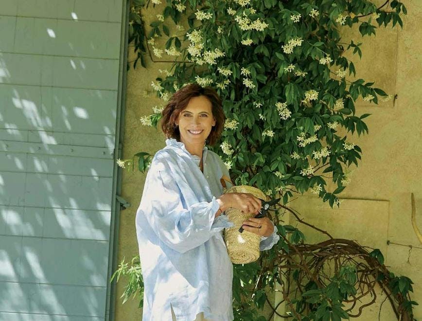 clothing apparel person human bush plant vegetation home decor sleeve