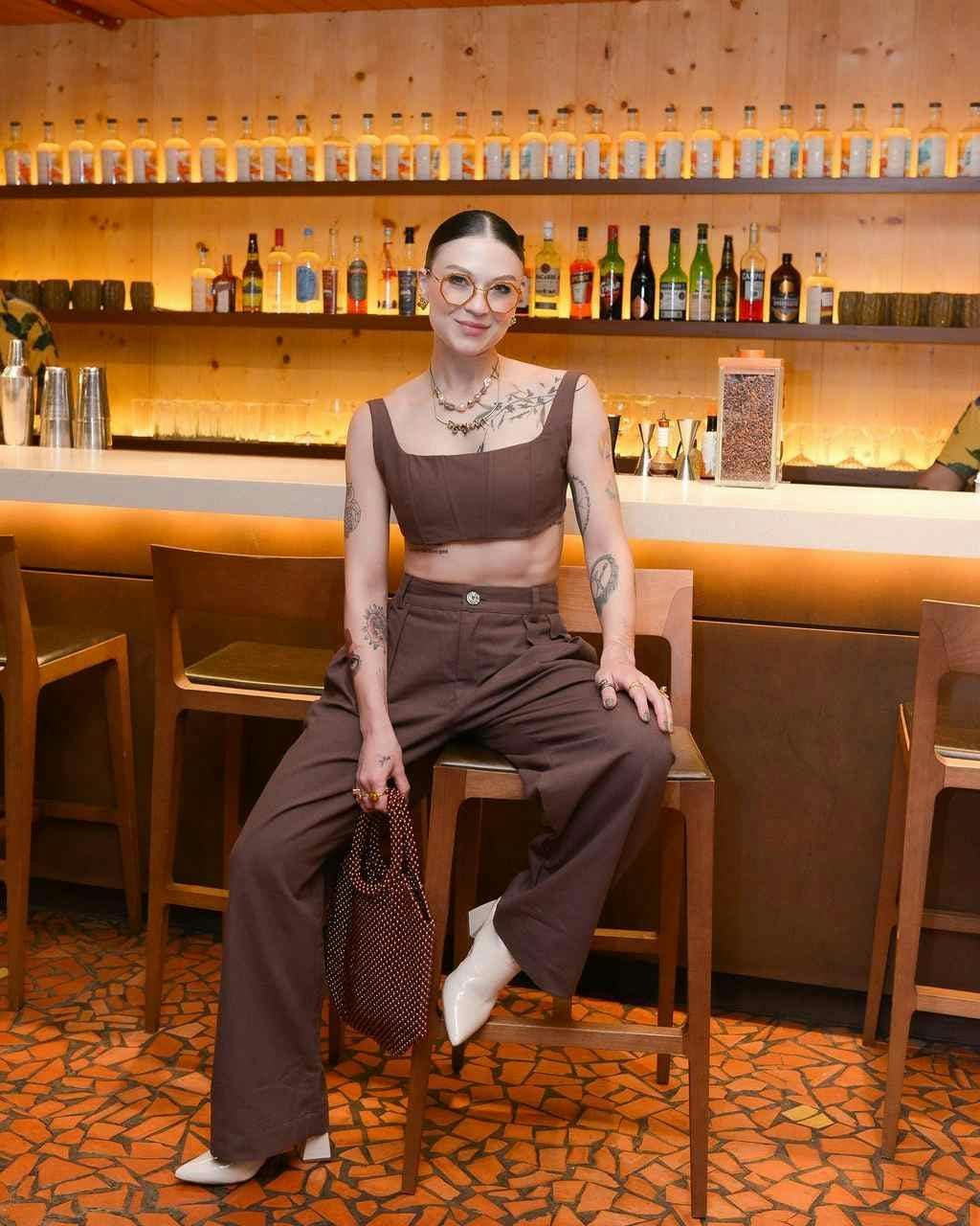 person sitting blouse clothing bar
