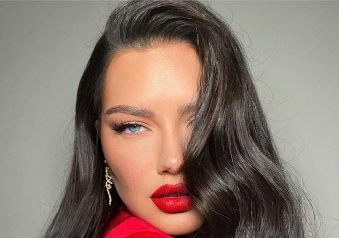 head person face adult female woman cosmetics lipstick
