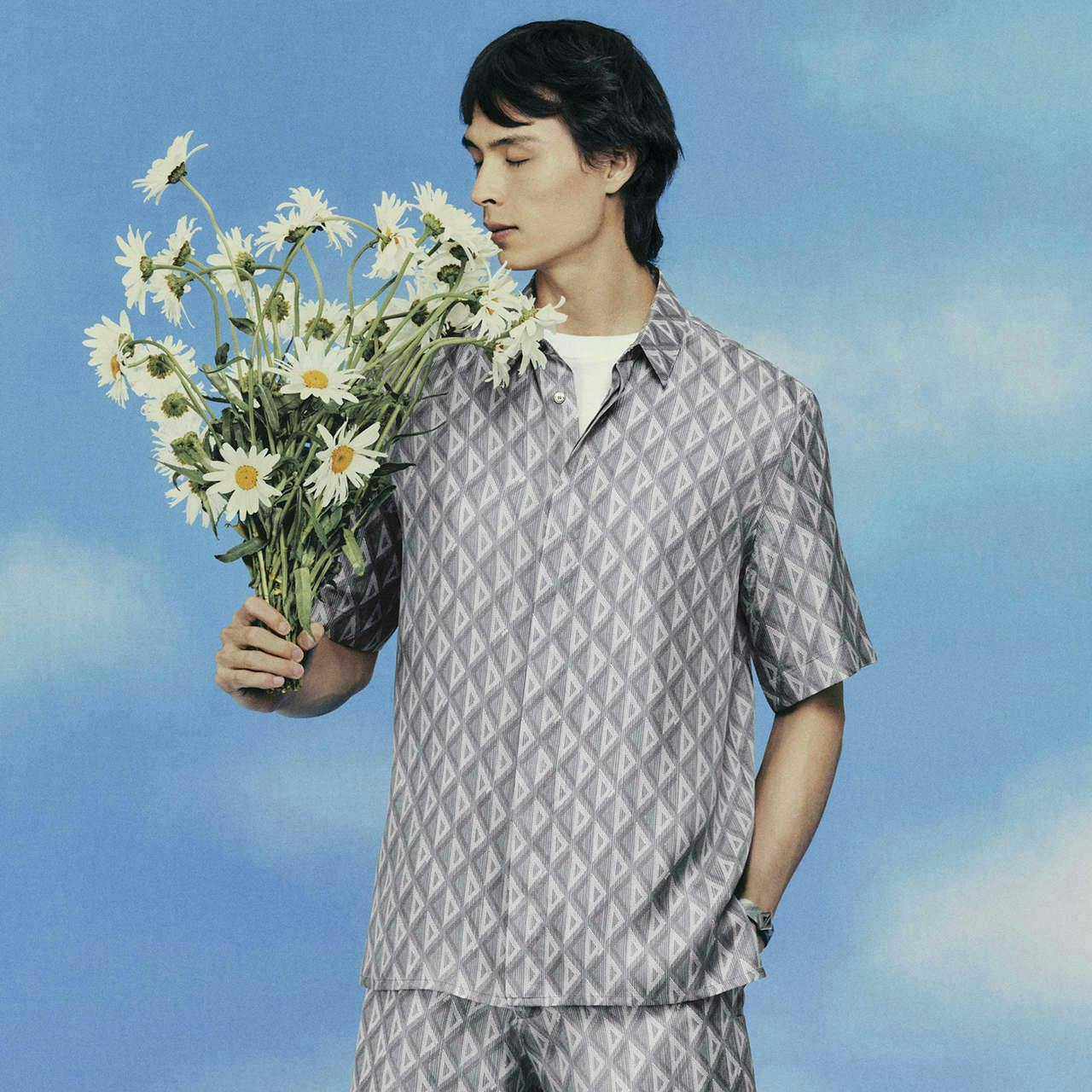 clothing sleeve person beachwear flower flower arrangement flower bouquet plant