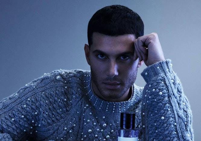 photography head person face portrait knitwear sweater bottle perfume sad