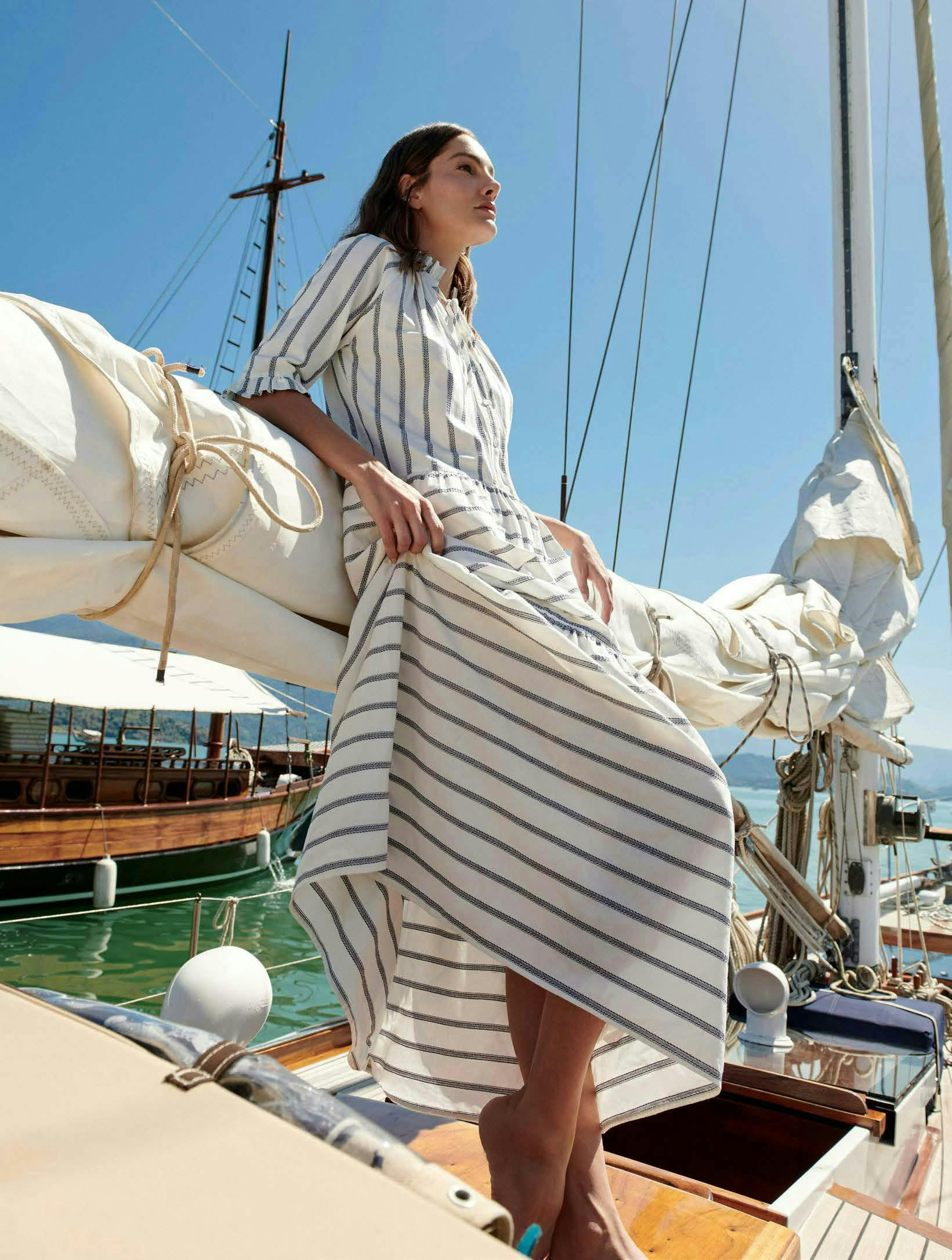 adult female person woman sailboat transportation vehicle yacht beachwear clothing