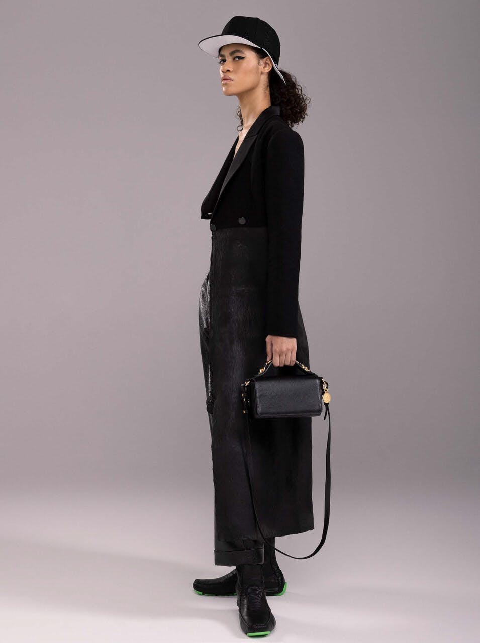bag handbag clothing coat formal wear suit long sleeve sleeve blazer person