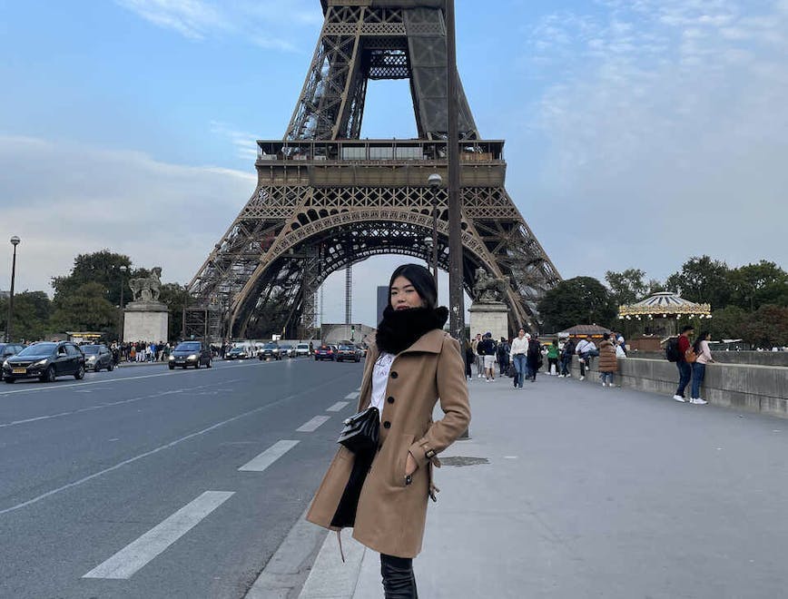 architecture building eiffel tower landmark tower clothing coat person