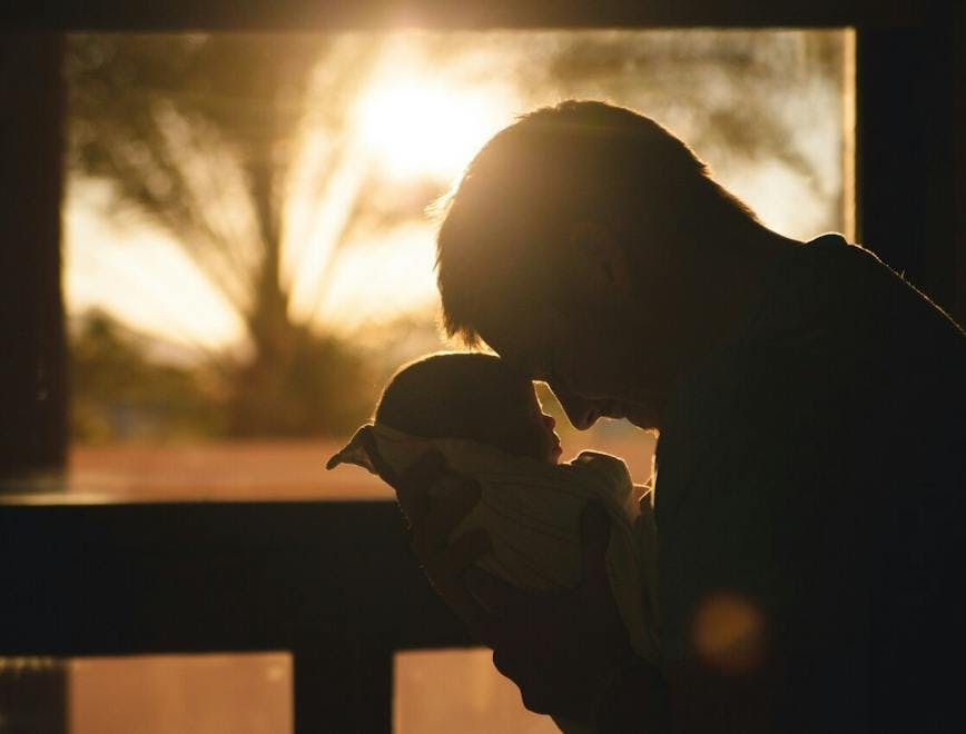 sunlight flare light photography person portrait outdoors sky baby kissing