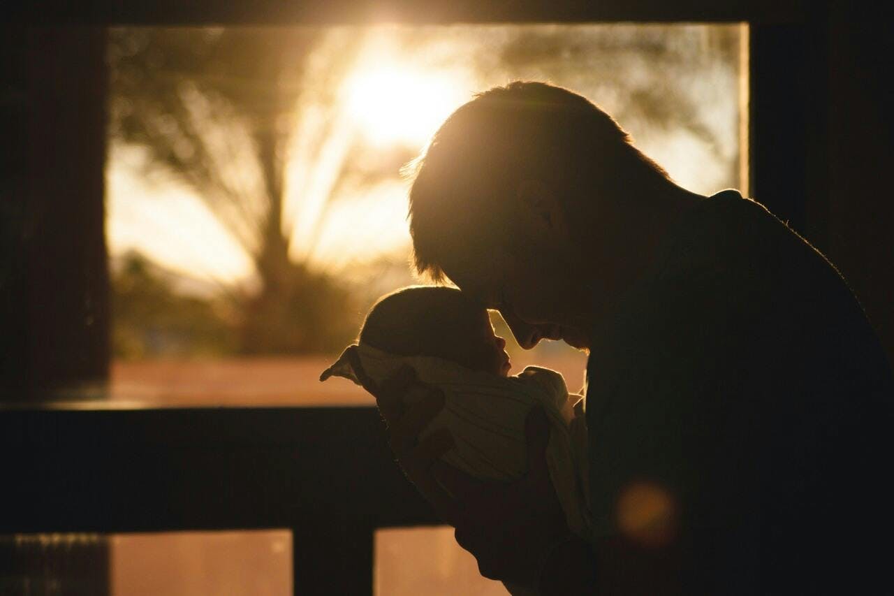 sunlight flare light photography person portrait outdoors sky baby kissing