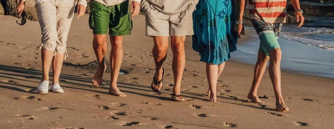 barefoot person shorts sandal adult female woman beachwear male man