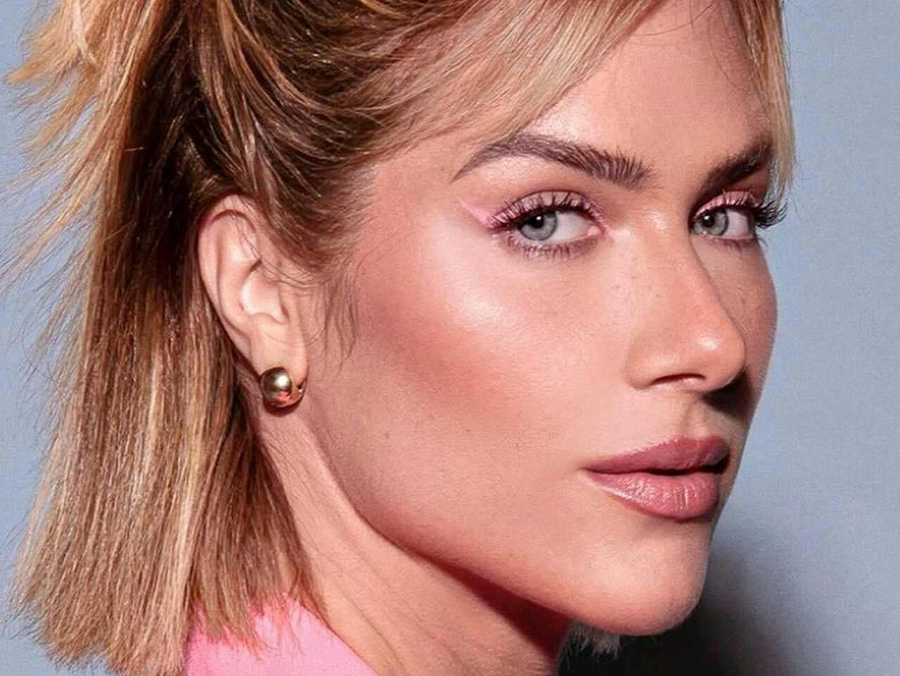 earring jewelry head person face adult female woman skin lipstick