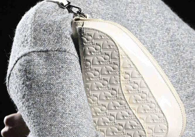 accessories bag handbag clothing coat jacket purse head person formal wear