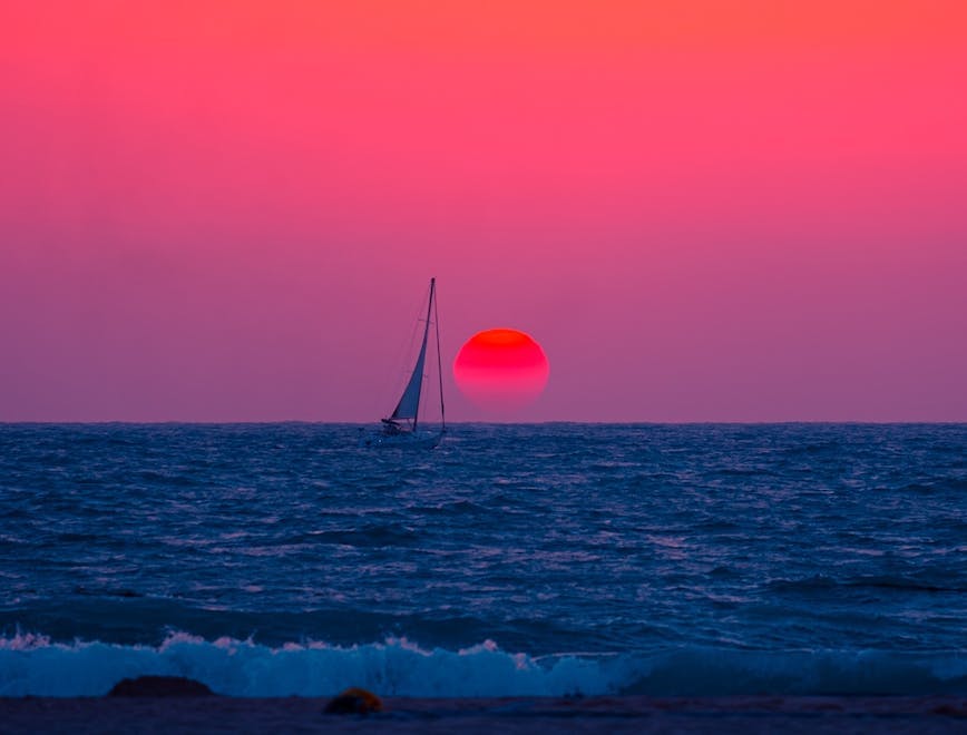 boat sailboat nature outdoors sky watercraft sunset horizon sunlight sea