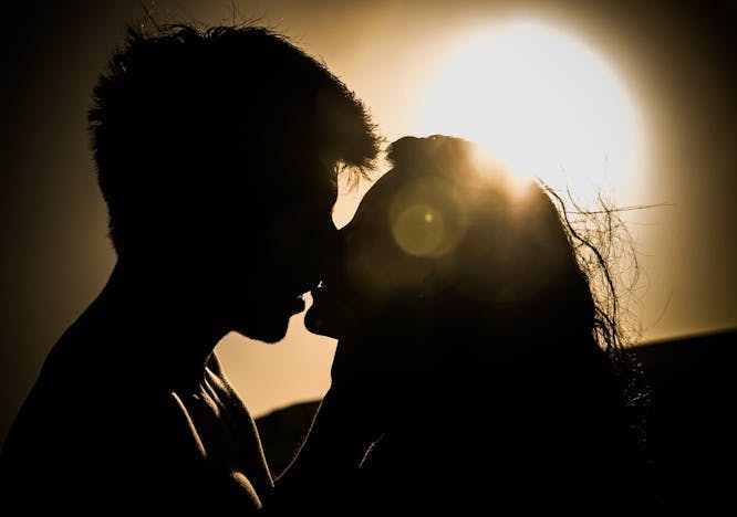 silhouette flare light outdoors sky kissing person romantic sunlight sun