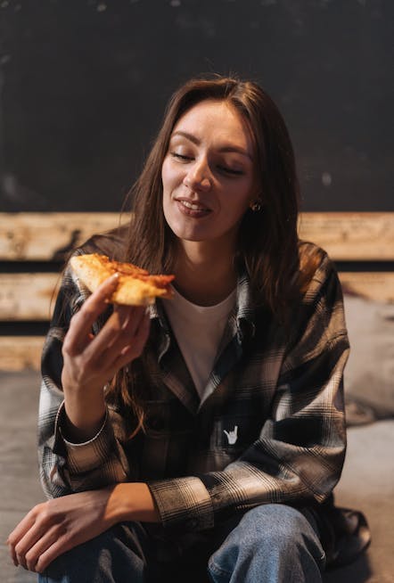 adult female person woman eating food face head pizza