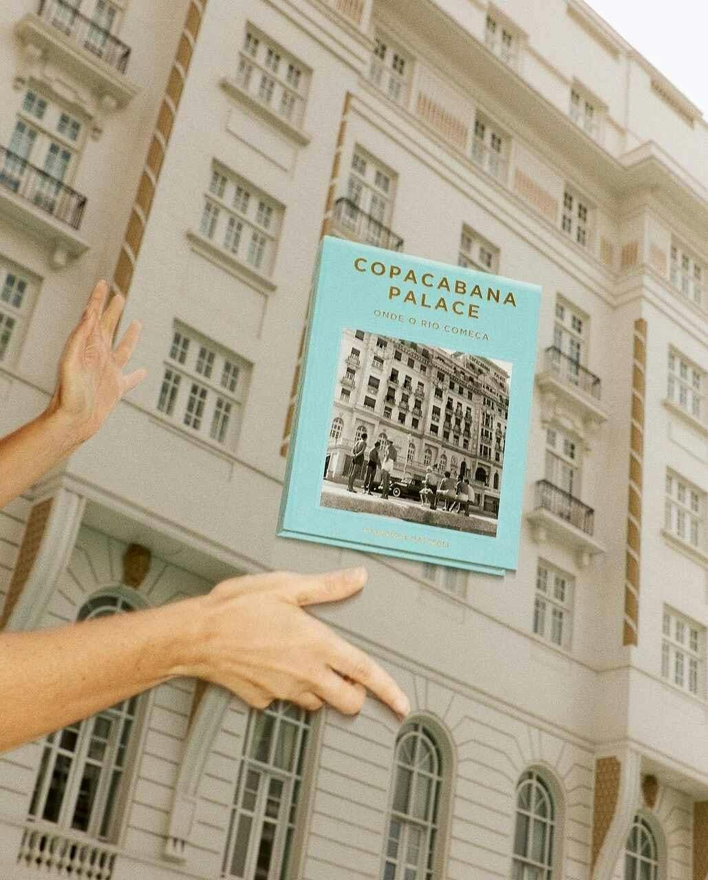 city book publication advertisement finger person poster building urban condo