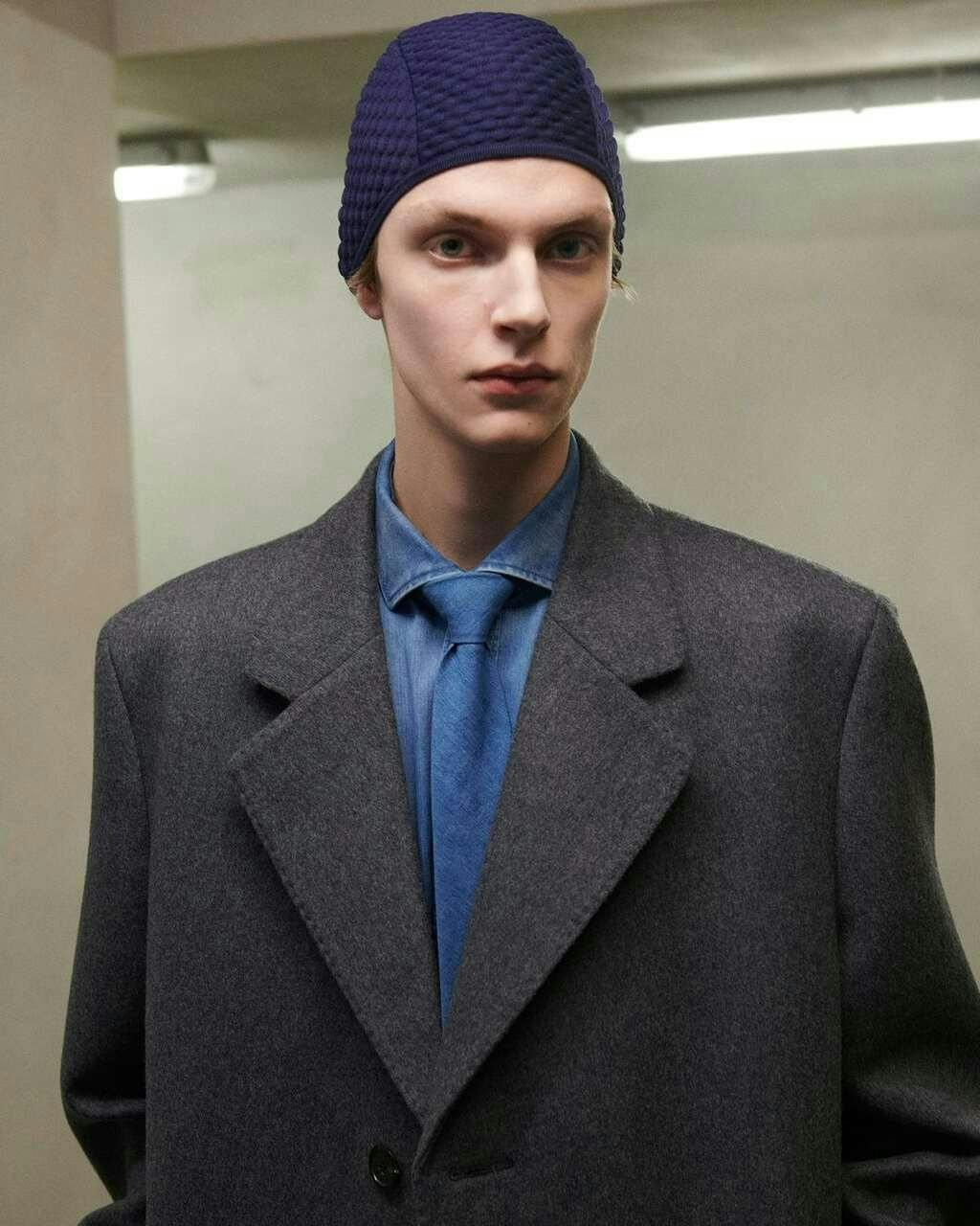 cap hat coat formal wear suit jacket adult male man person