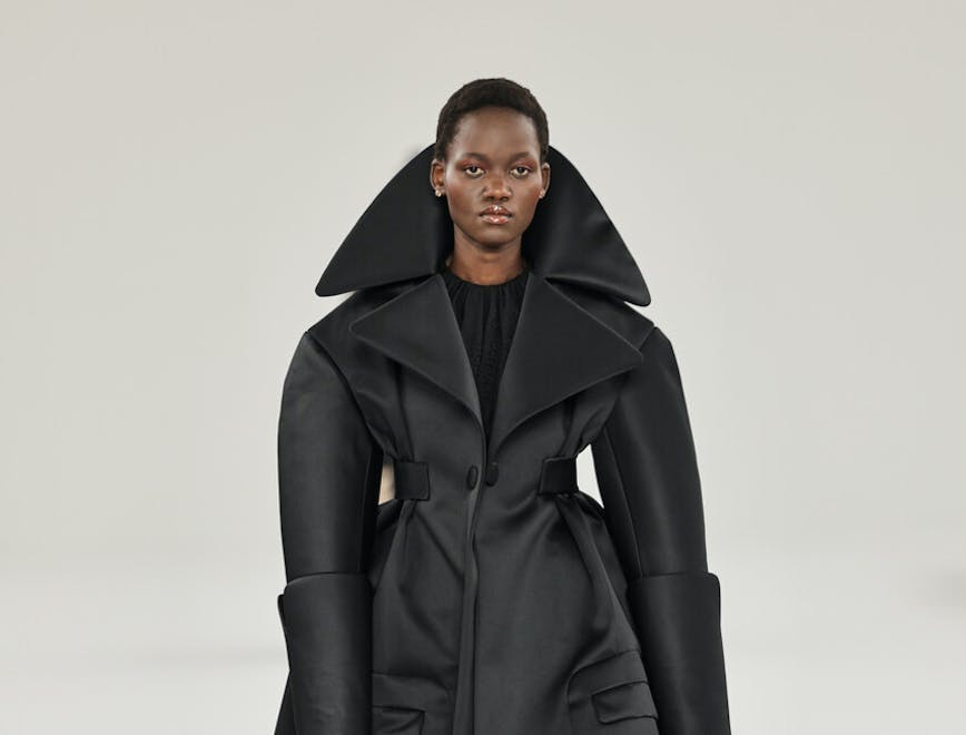 clothing coat overcoat trench coat face head person