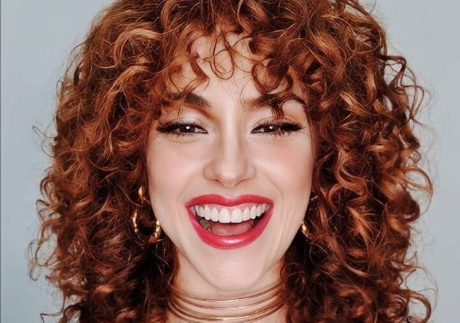adult female person woman head face smile hair lipstick brown hair