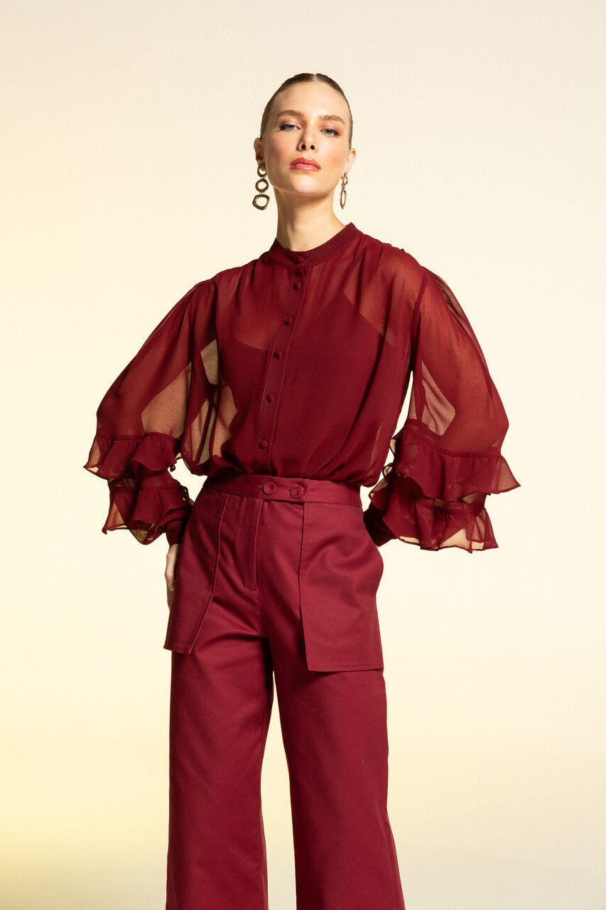 blouse clothing person long sleeve sleeve maroon face head coat